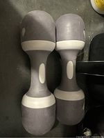 Two grey 5-lb dumbbells side by side