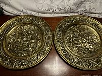 Both gold-tone embossed wall plates front view