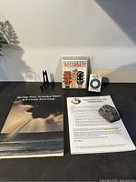 Lot overview showing books, CD, metronome, one card stand, hide-a-key rock