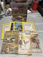 Group shot showing all eight magazines: Tornado 1985, three Canadian Tire, four National Geographic