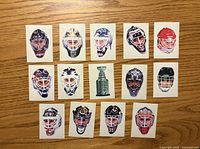 Fronts of all 14 stickers showing goalie masks and Stanley Cup