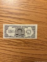 Front of 1962 Topps Football Buck showing Raymond Berry portrait and $5 denomination