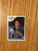 Front of Doug Gilmour 1985-86 O-Pee-Chee card showing player image and team logo