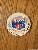 Front of button showing printed design and date