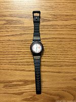 Front view showing dial, bezel and printed strap text