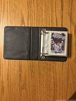 Binder open showing card sleeves