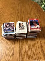 Three stacks of baseball cards on table