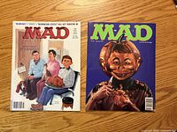 Front covers of both MAD magazines