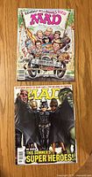 Front covers of both MAD Magazine issues