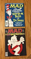 Front covers of both MAD magazines