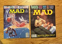 Front covers of both MAD magazines