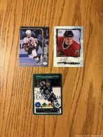 Front of three Doug Gilmour hockey cards