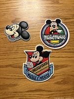 Front view of three Mickey Mouse embroidered patches