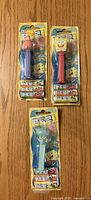 Front view of three sealed SpongeBob Pez dispensers