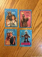 Front view of four 1987 ALF stickers showing captions and character images