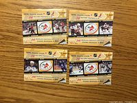 Front view of four sealed NHL Replay card packs showing player images and Replay logo