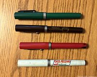 Four Sheaffer pens with caps on showing barrel colours and imprints