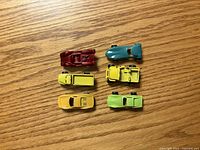 Six miniature cars top view showing colors and models