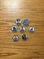 Fronts of seven hexagonal Topps Star Wars Connexions chips