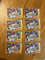 Front view of eight sealed Be a Hero Marvel sticker packs on tabletop