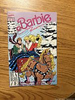 Front cover showing Barbie issue 2 winter sleigh scene