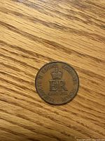 Reverse side displaying E II R cypher and inscription