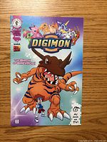 Front cover showing Digimon Digital Monsters comic, issue #1, "The Birth of Greymon!"