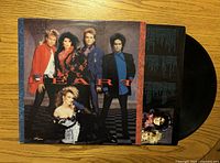 Front cover of Heart self-titled LP with record partially visible