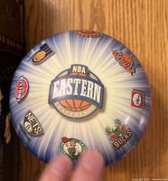 Blue Eastern Conference side of NBA toy ball with team logos visible