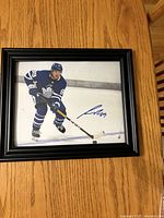 Front view of signed, framed Nick Robertson photo