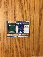 Front of card with player image and jersey swatch