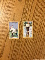 Front view of both Gallaher British Champions cards showing athlete illustrations
