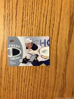 Front of Sam Reinhart Fresh Threads card showing jersey swatch and player image