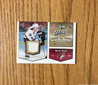 Card front with Shane Doan image, white jersey swatch and MVP One on One branding