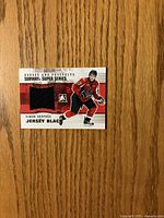 Front of jersey card with player image and black swatch