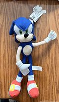 Front view of 12-inch Sonic the Hedgehog plush showing hang tag and overall condition