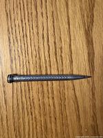 Full view of sterling Wahl Eversharp mechanical pencil on wood surface