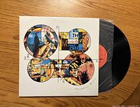 Front jacket and vinyl partially pulled from sleeve