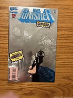Front cover of The Punisher #100 showing foil design and issue details