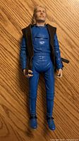 Front view of blue-suited Johnny West figure with black vest
