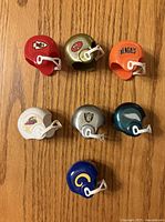 Front view of seven mini helmets