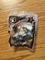 Front of sealed White Pantera Happy Meal toy showing character graphics and series details