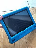 Front view of tablet in blue case, screen visible