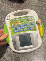 Front view of LeapFrog Scribble & Write showing keypad, display and stylus