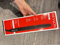 Front of sealed Revlon Smoothstay curling iron box