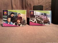 Front view of both U2 MusiCards #101 and #106 in top-loaders