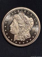 Obverse of the copper round showing Morgan design