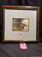 Front view of framed Luigi Moroni embossed silver relief artwork