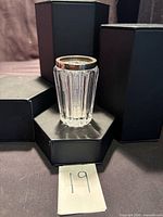 Full view of ribbed cut glass jar with sterling rim