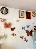 Group view showing all butterfly decorations, mirror and Lorus clock on wall